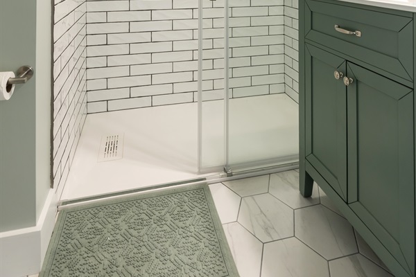Tiled shower and vanity offer a great bathroom between bedroom 3 and 2.