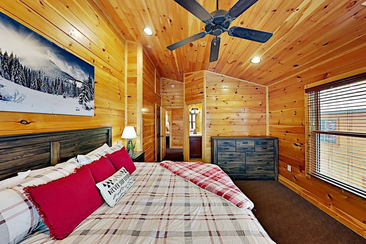 Bedroom with full bathroom en-suite and dresser storage.