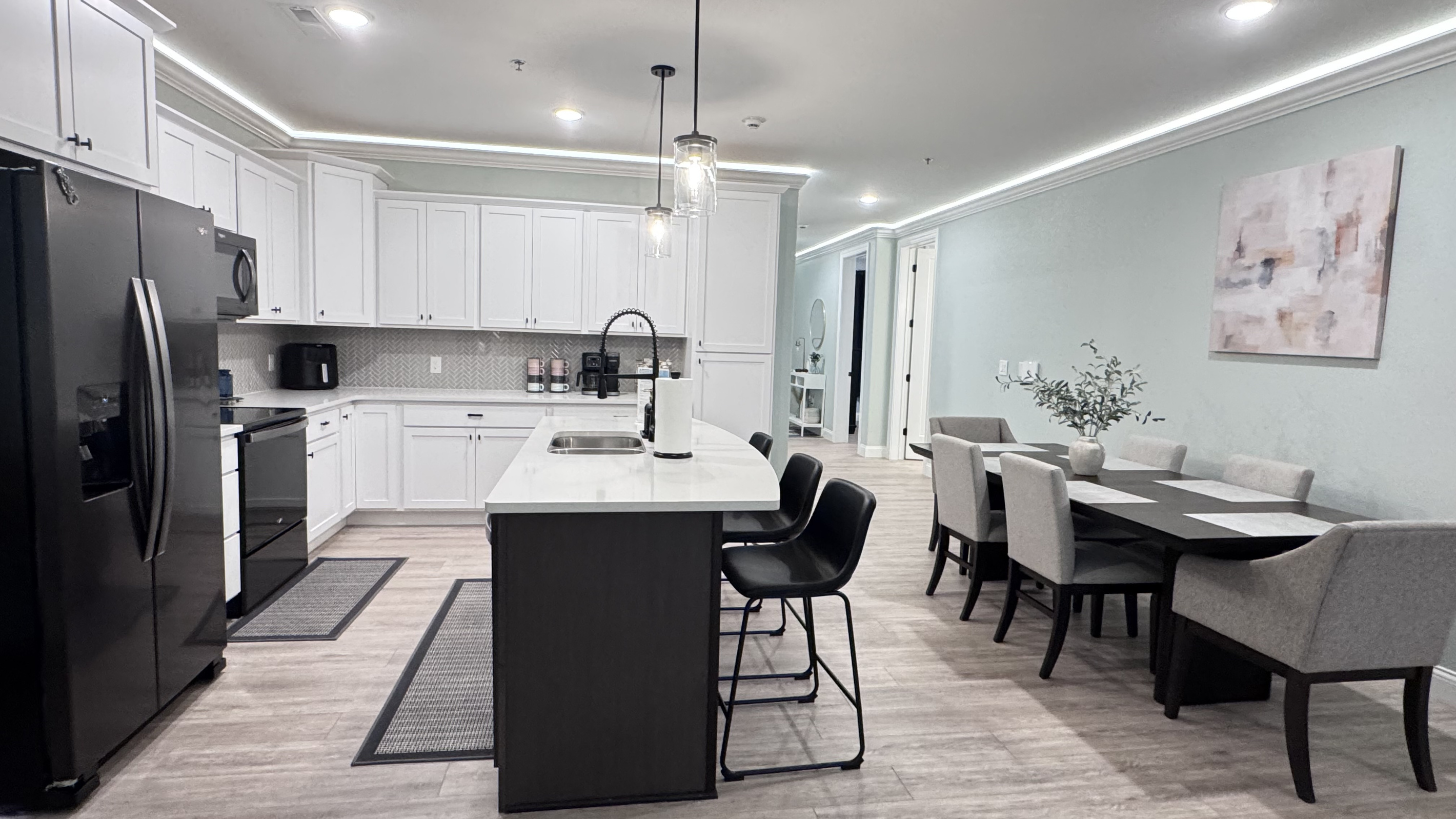 Kitchen island provides easy flow around the kitchen and extra seating at the bar.