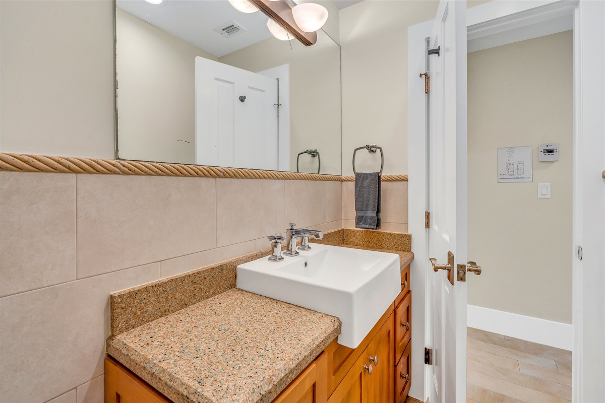 Another full bathroom with a walk in shower across the hall from Bedroom #3.