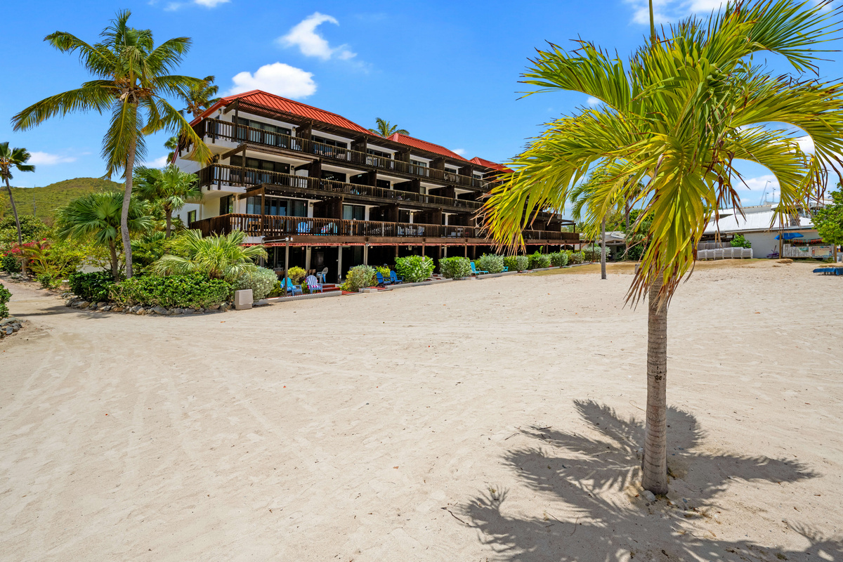 Your beachfront escape is nestled among vibrant palms and Caribbean beauty.