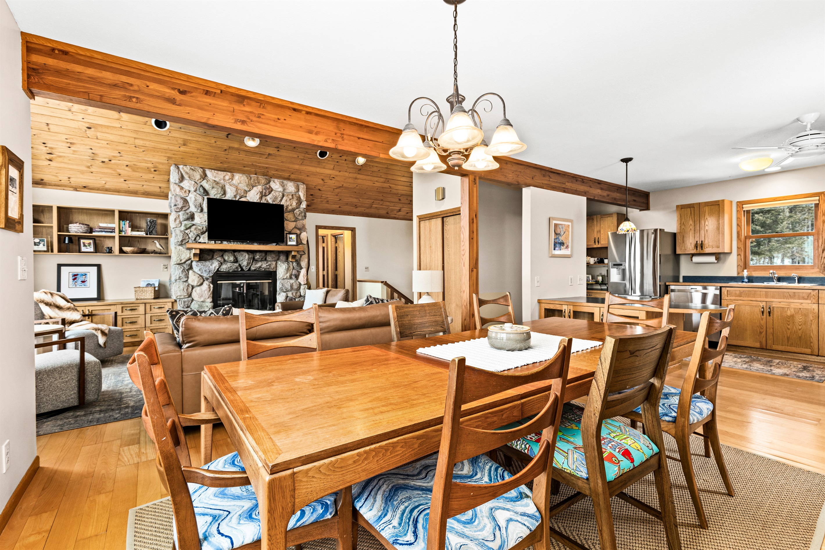 Flowing design from the dining room to the cozy living room, leading to the private primary bedroom upstairs. This seamless layout enhances comfort and accessibility, creating a warm and inviting space for relaxation and connection.