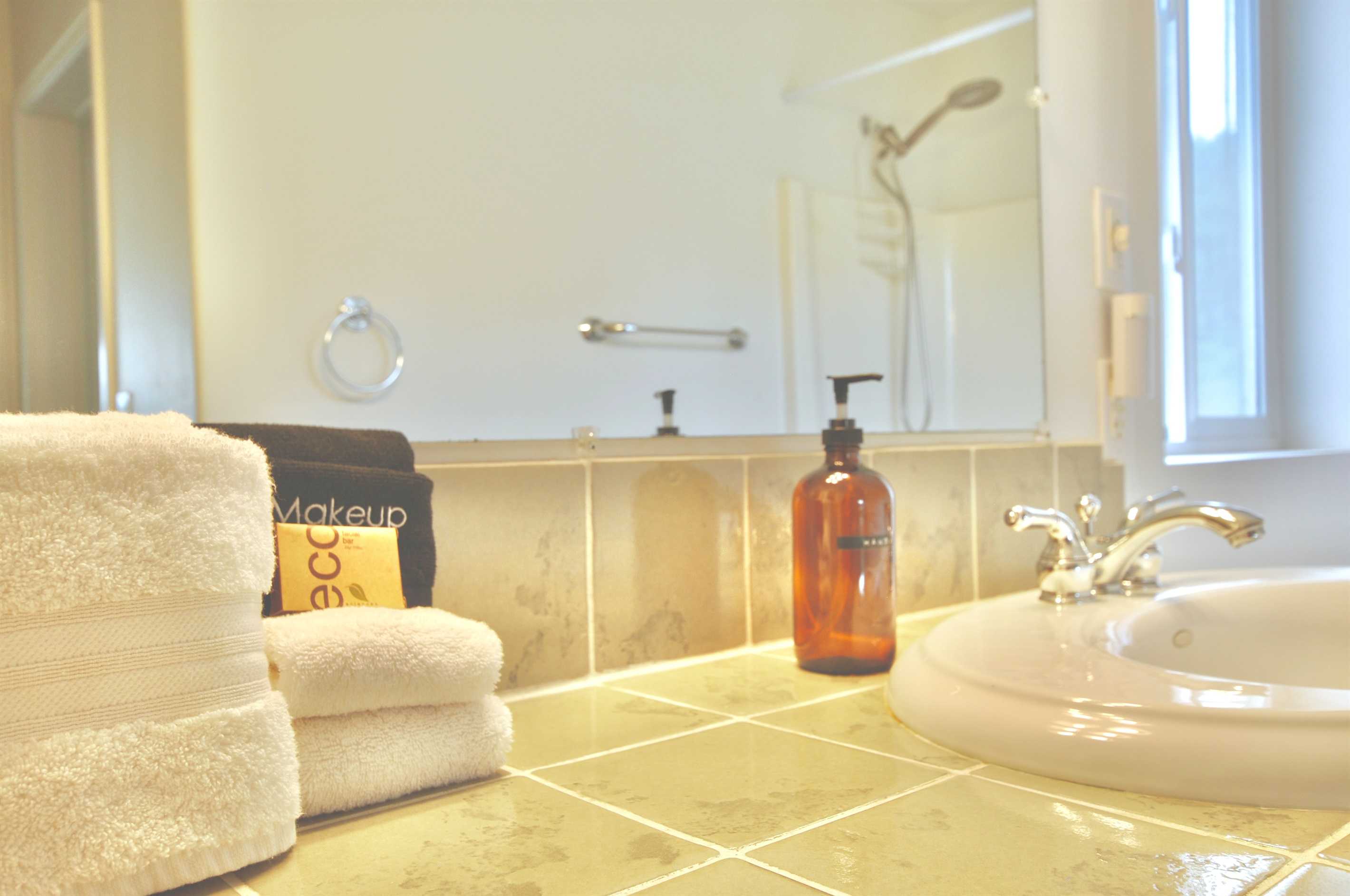 Upstairs bathroom with bathtub and shower.