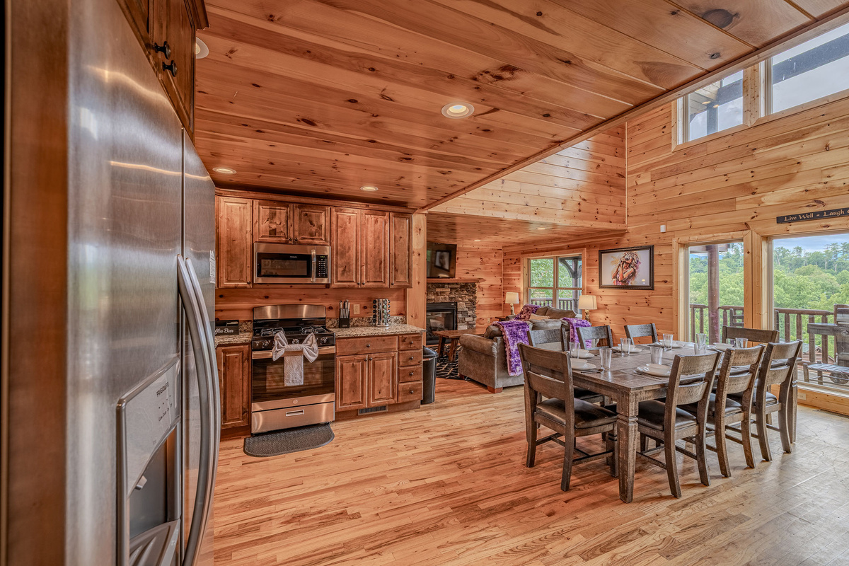 Open to the dining and living spaces, the kitchen keeps the cook connected to the rest of the cabin.
