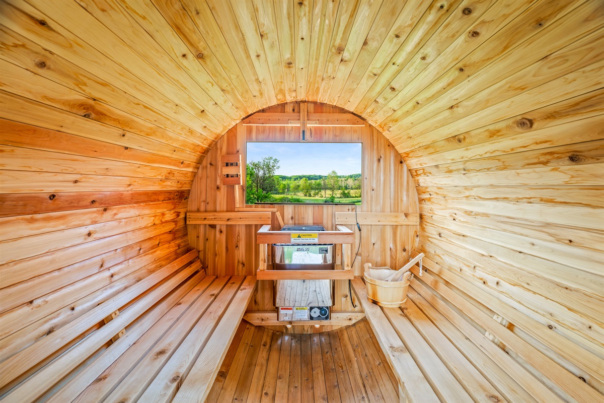 Your private barrel sauna escape. Warm cedar, peaceful views, and a full-body reset after a family day out.