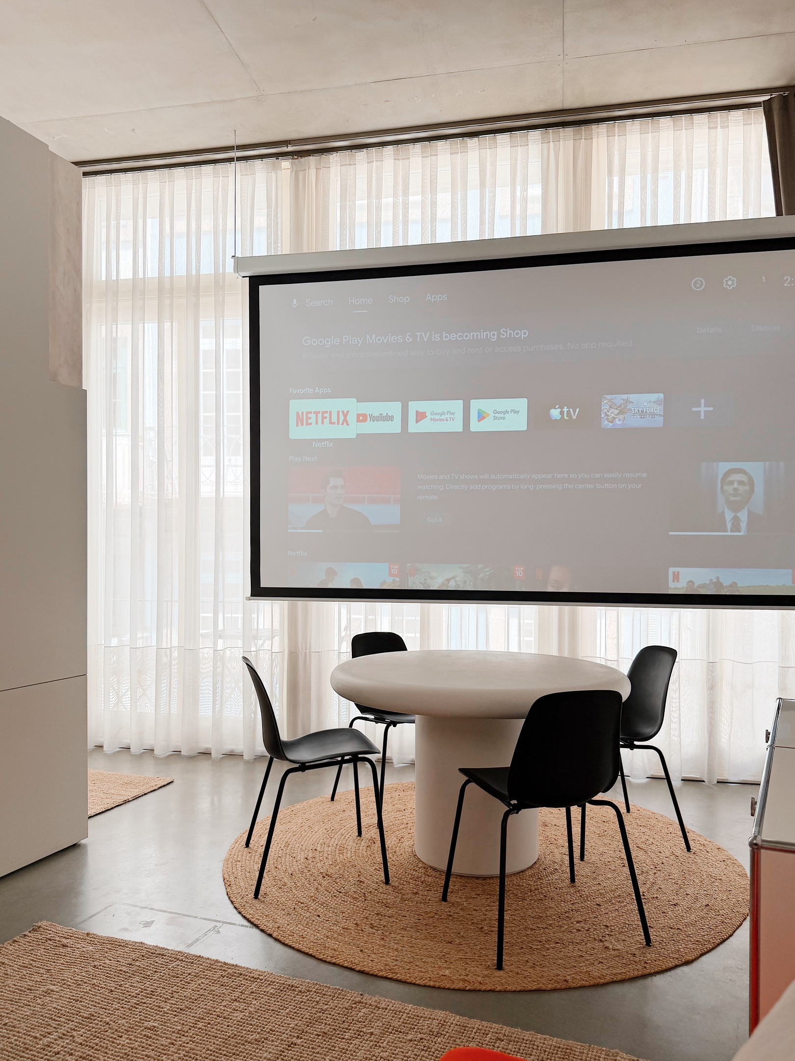 Motorized projection screen. Bring your own logins.