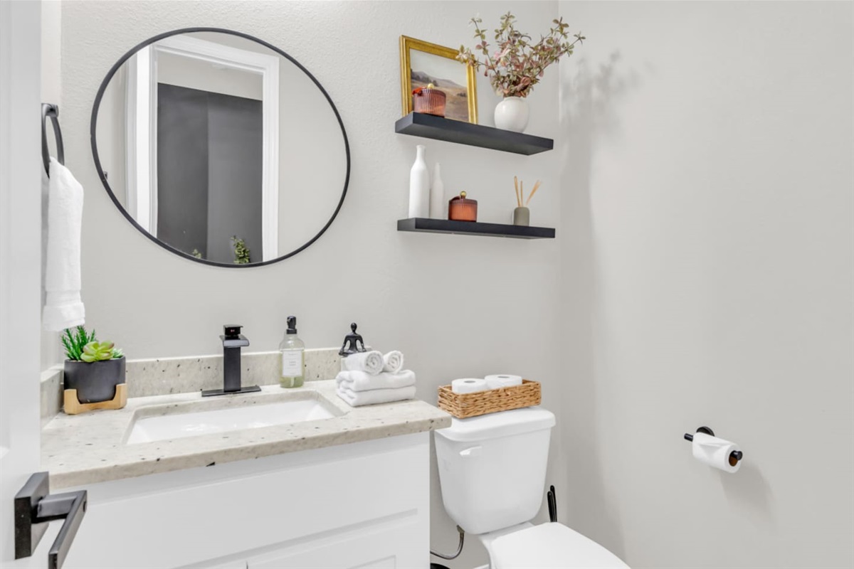 Second full bathroom with chic tile and modern fixtures.
