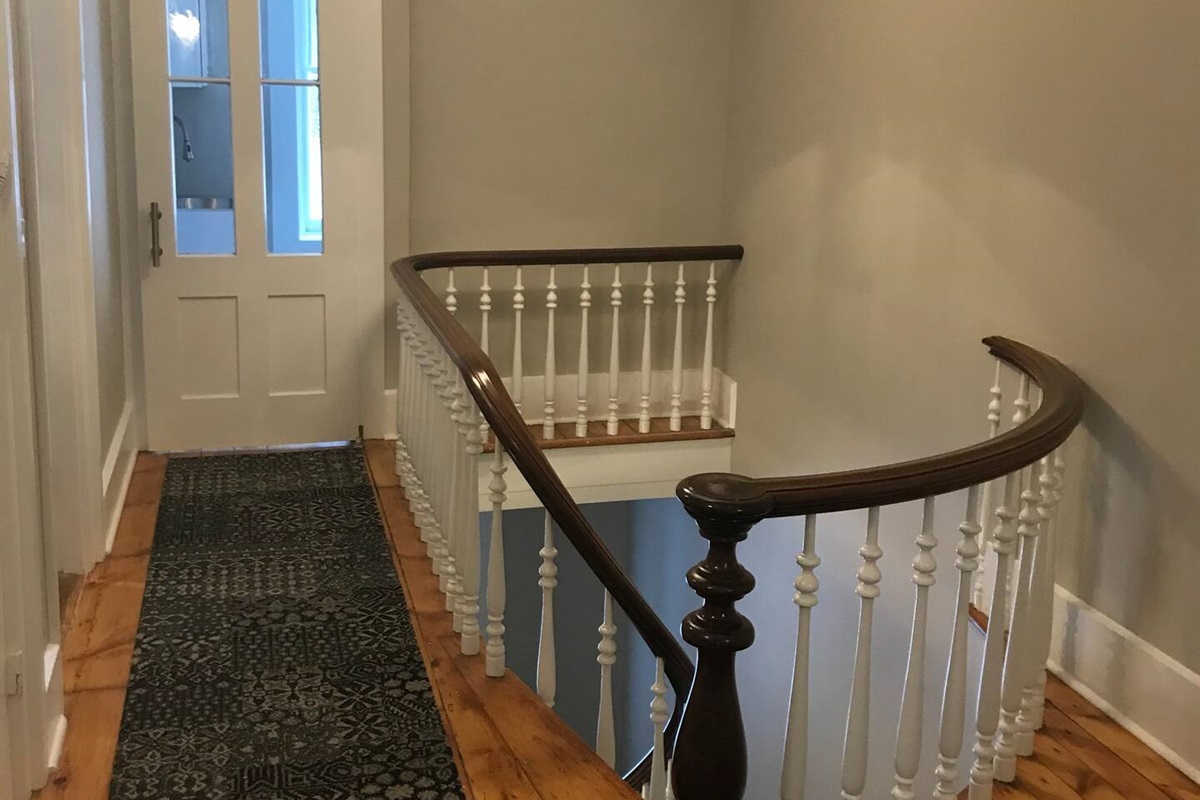 Top of stairs leading to laundry room