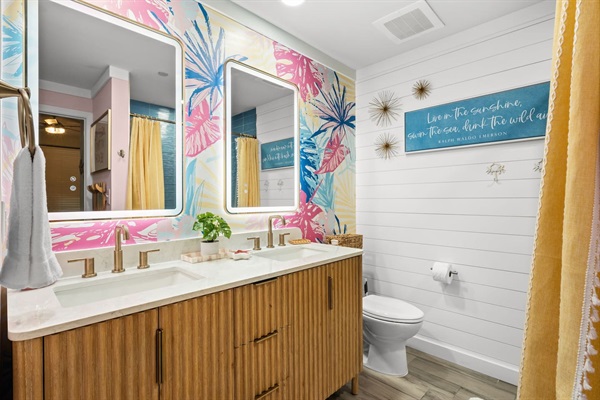 Newly remodeled guest bathroom with vibrant colors & LED mirrors
