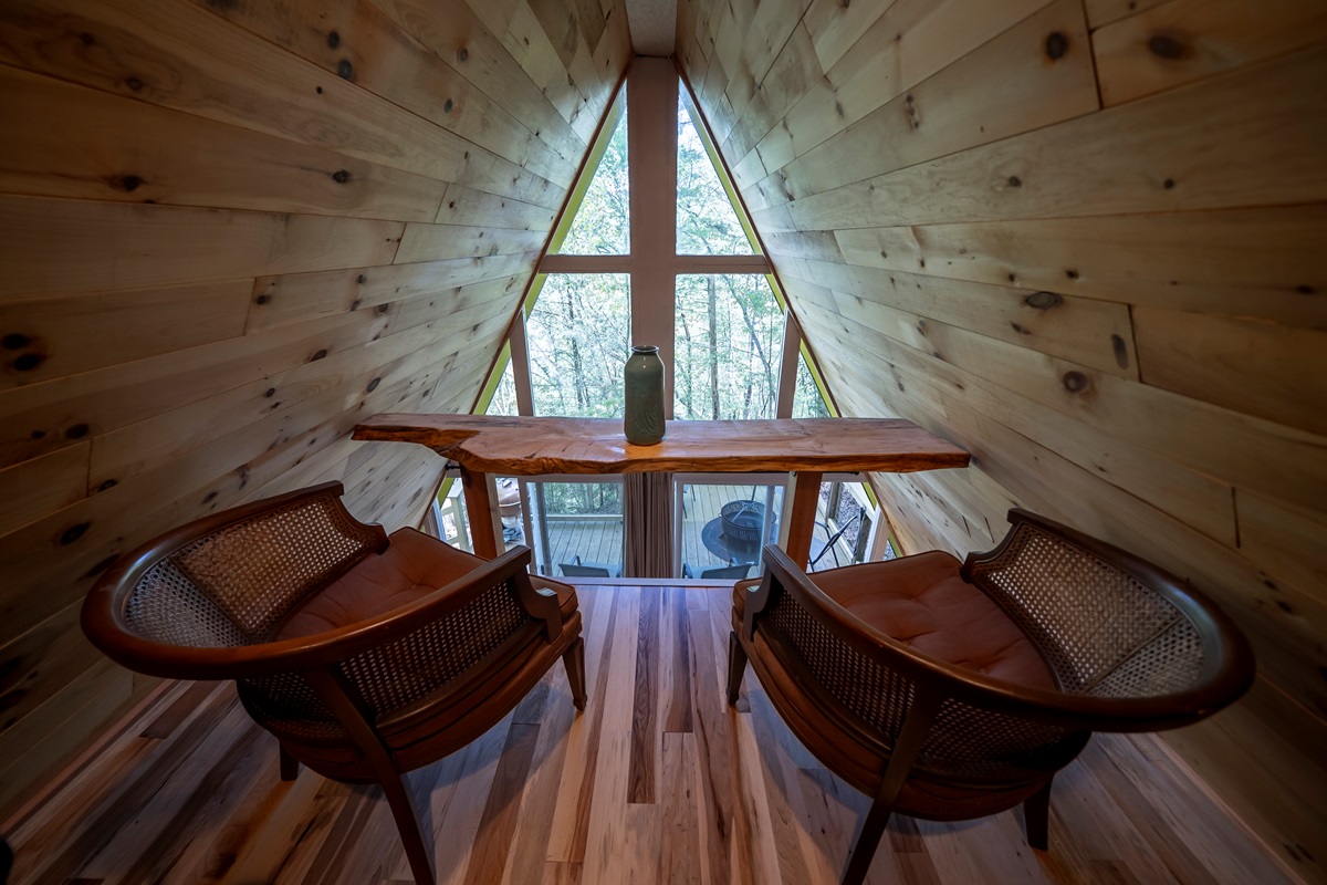 Start your morning here with a cup of coffee and a quiet view of the woods below.