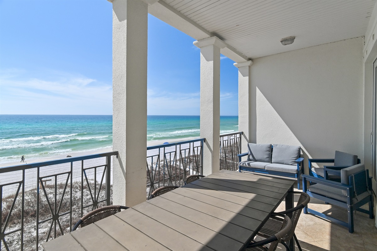 Frangista Sunset's main living area patio has a large dining table and comfortable lounge furniture - perfect for dining, morning coffee, or a cold afternoon beverage!