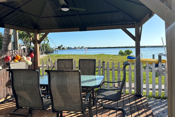 Outdoor Gazebo with Television, Ceiling fan and ring toss game.