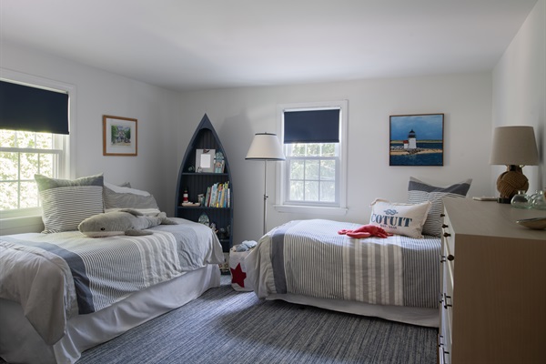 Bedroom 4 offers two comfortable double beds, ideal for younger guests.