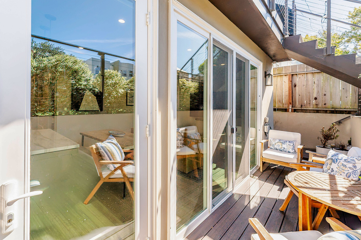 Comfy dedicated patio with pair of lounge chairs & bistro set for two