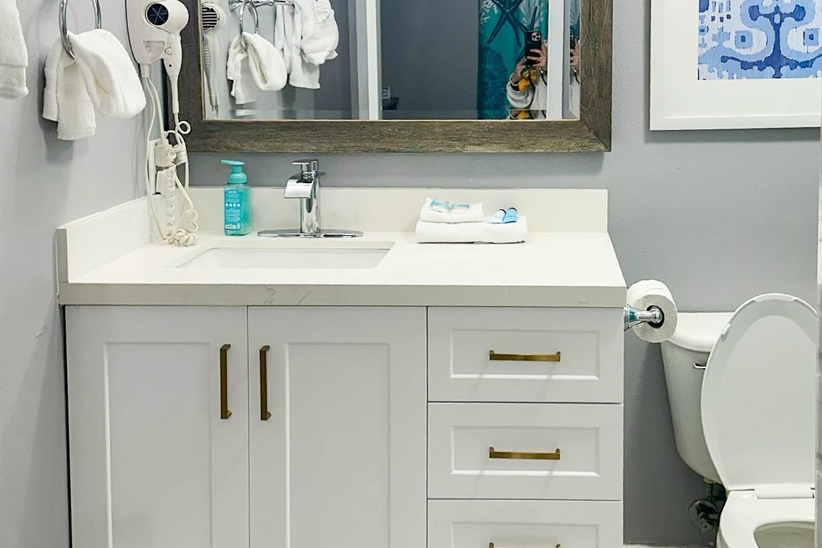 Ensuite master bathroom has a full shower/bathtub combo with huge rain shower head