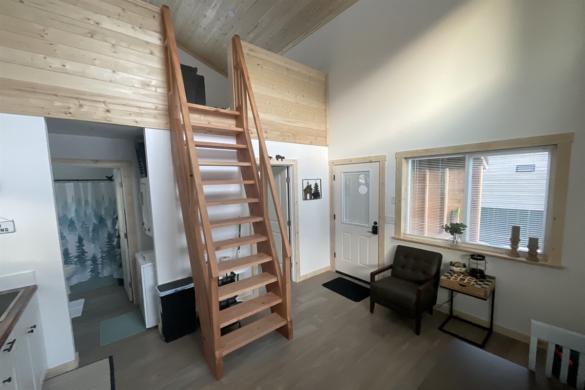 Main floor area.  Bathroom and laundry are in the left front and bedroom is in the left rear.  Ships ladder access to the loft living area and additional sleeping space.