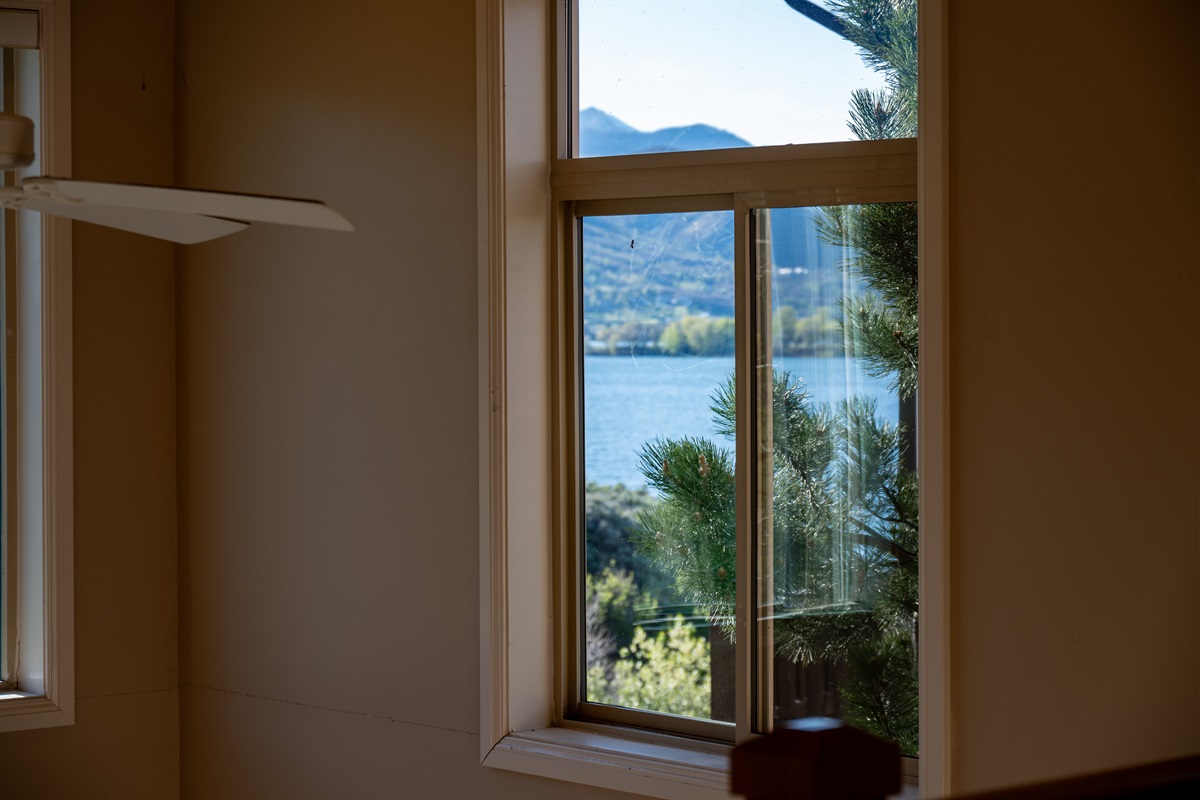 Peaceful mountain and reservoir views are visible from the home.