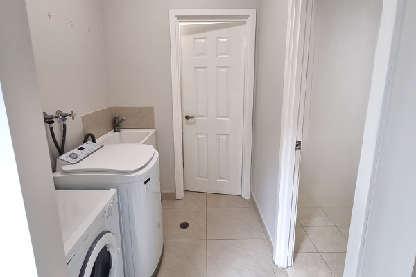 Laundry area with separate toilet & access to 2nd bathroom