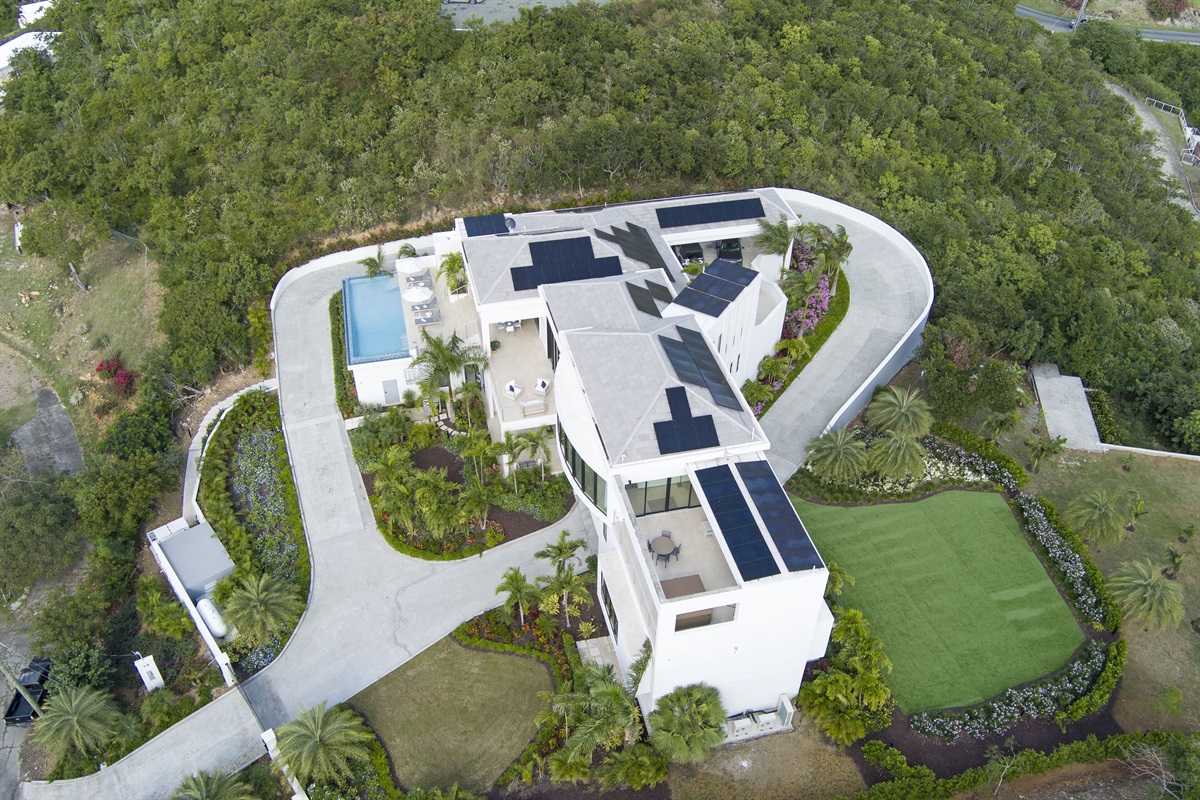 The villa has solar, Tesla power walls and a backup generator for backup power. The driveway pulls all the way around and delivers you to the front door stairs.