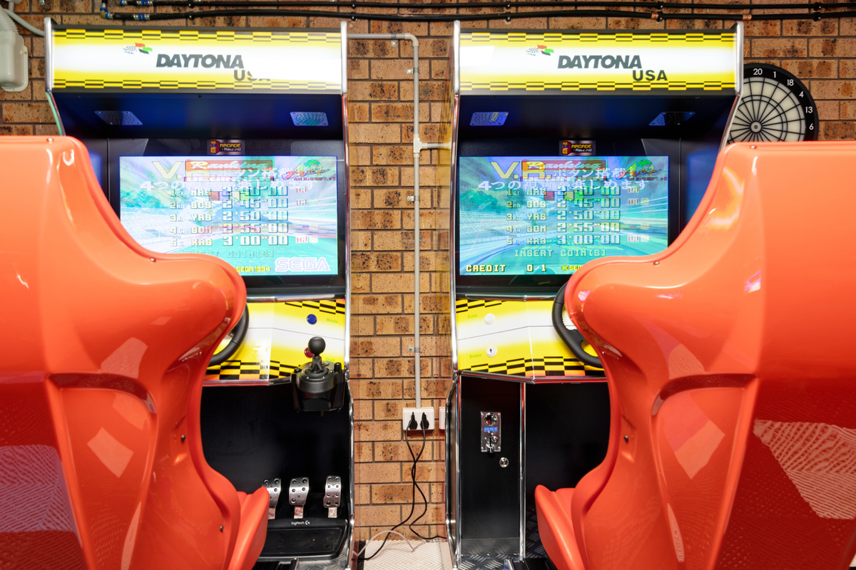 The games room at Skye’s Beach House includes two linked Daytona racing machines, bringing a proper arcade-style racing setup to the stay.