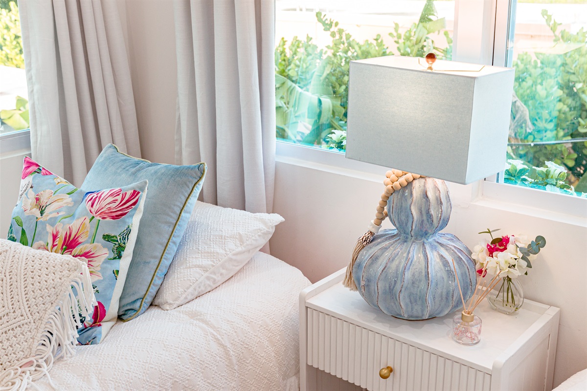 Our first cottage bedroom features two double beds, stylishly designed and very comfortable.