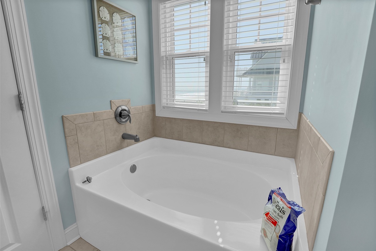 A deep soaking tub—the perfect place to relax after a long day on the beach.