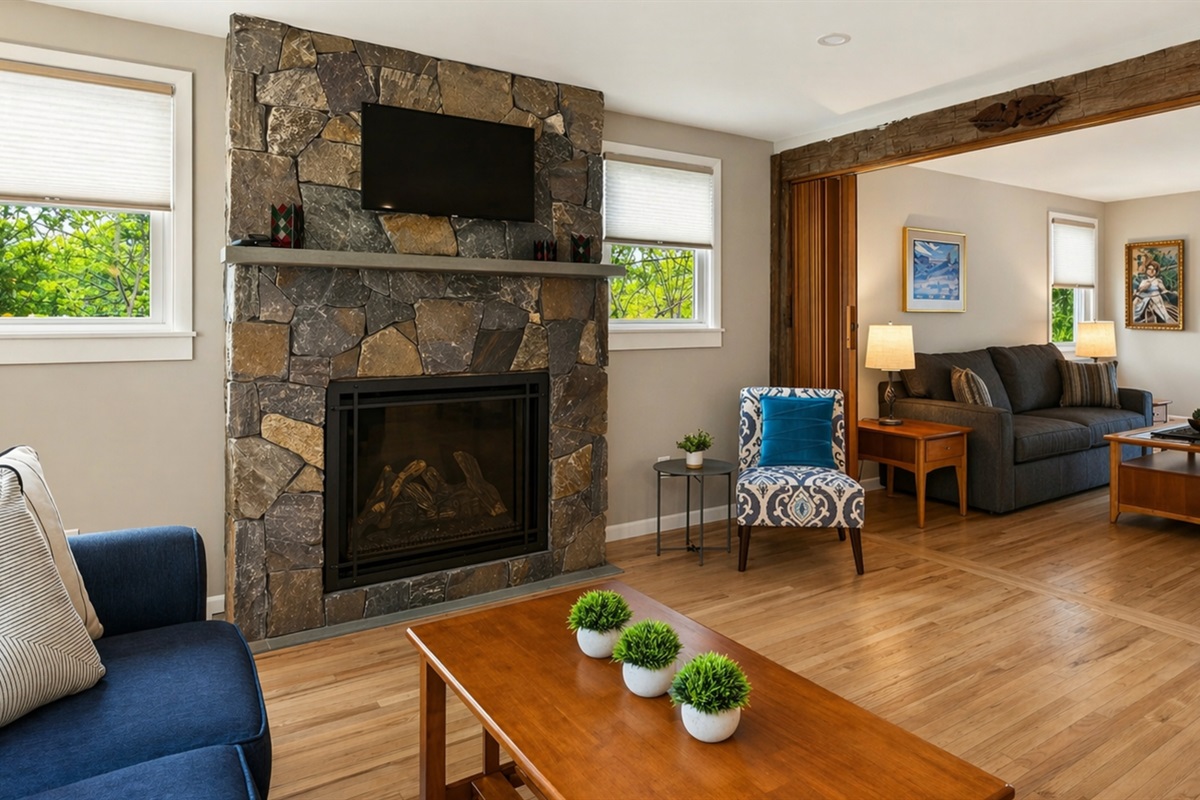 Living room to extends into a secondary seating area with queen fold out sofa