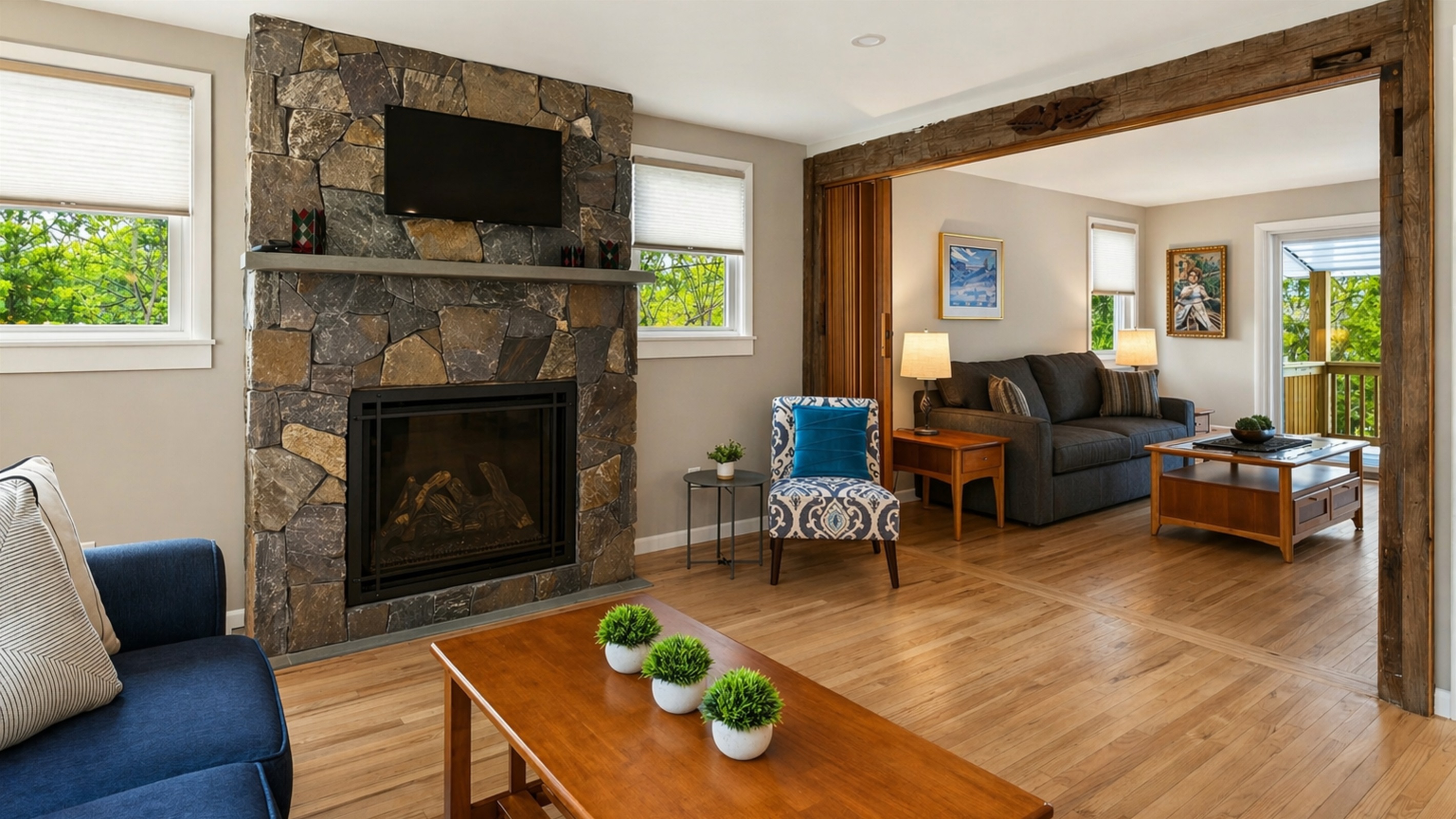 Living room to extends into a secondary seating area with queen fold out sofa