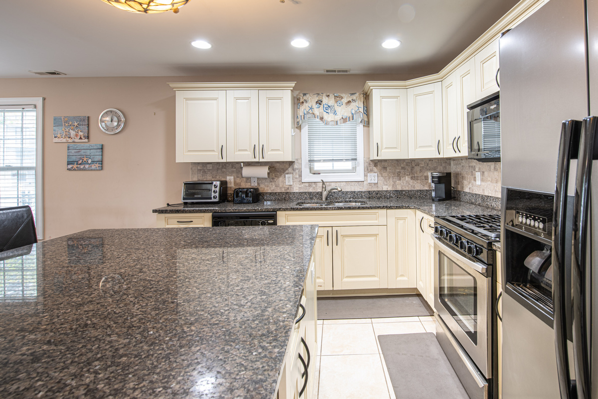 Kitchen Overview Featuring Stainless Steel Appliances and Center Island