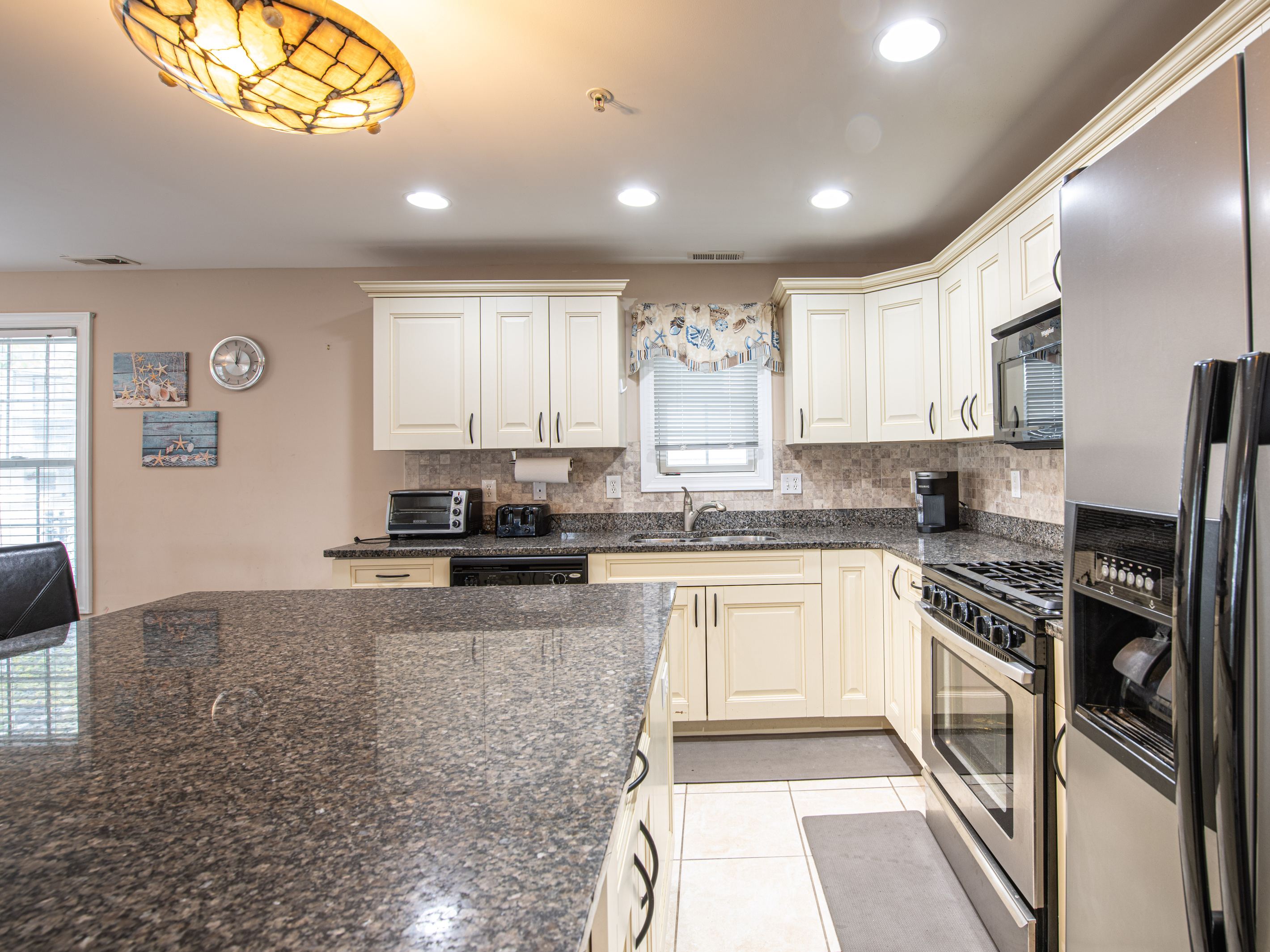 Kitchen Overview Featuring Stainless Steel Appliances and Center Island