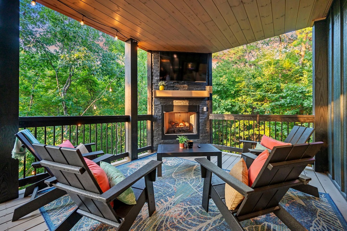 Gas fireplace and TV on the lower deck is just off of the game room and on the same deck as the hot tub.