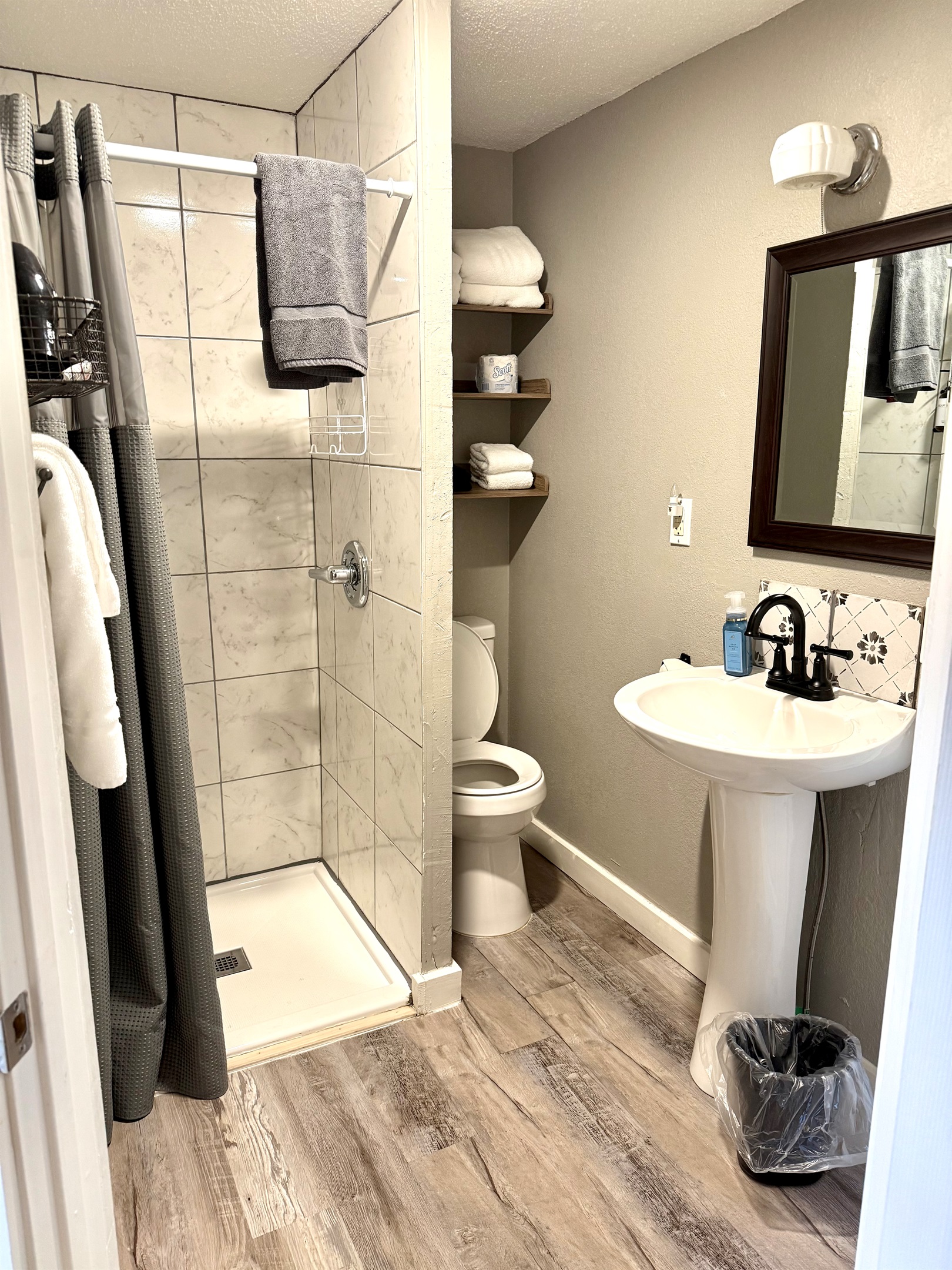 Keep in mind the toilet area is a little tight to the wall.