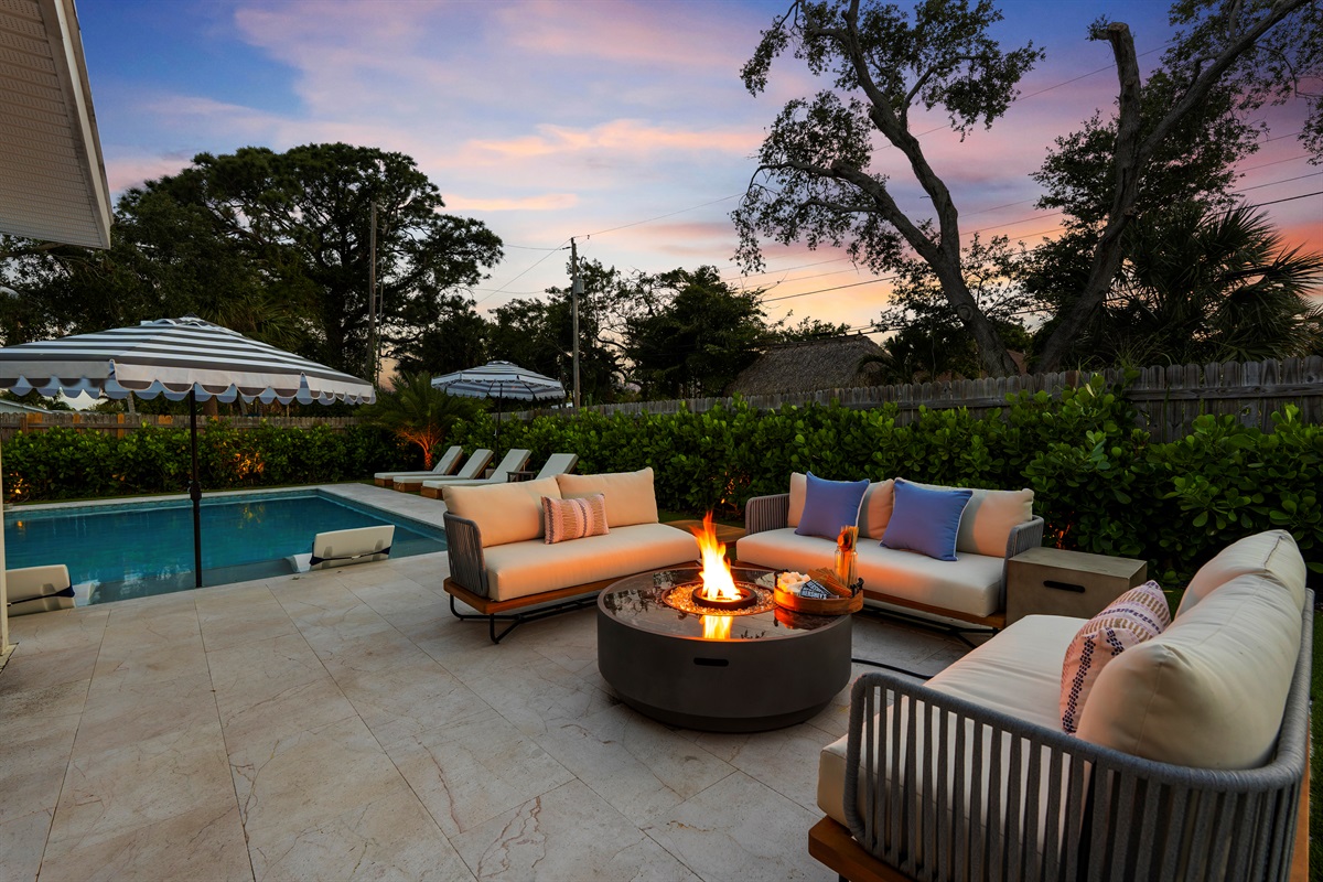 Evenings come alive around the glowing fire pit — the perfect setting for sunset cocktails, late-night conversations, and cozy moments under the stars.