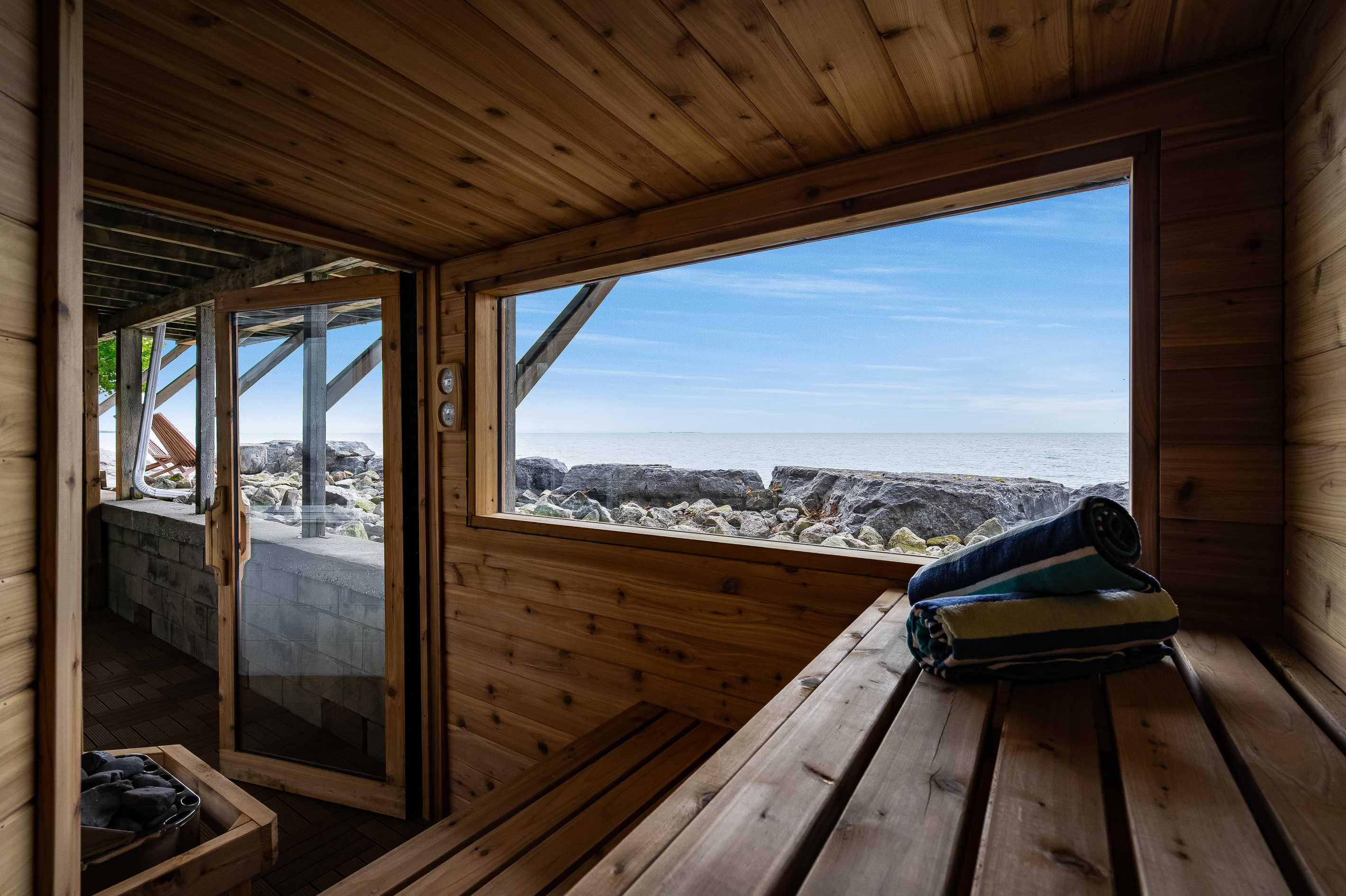 Peaceful sauna retreat with panoramic views of the waterfront.