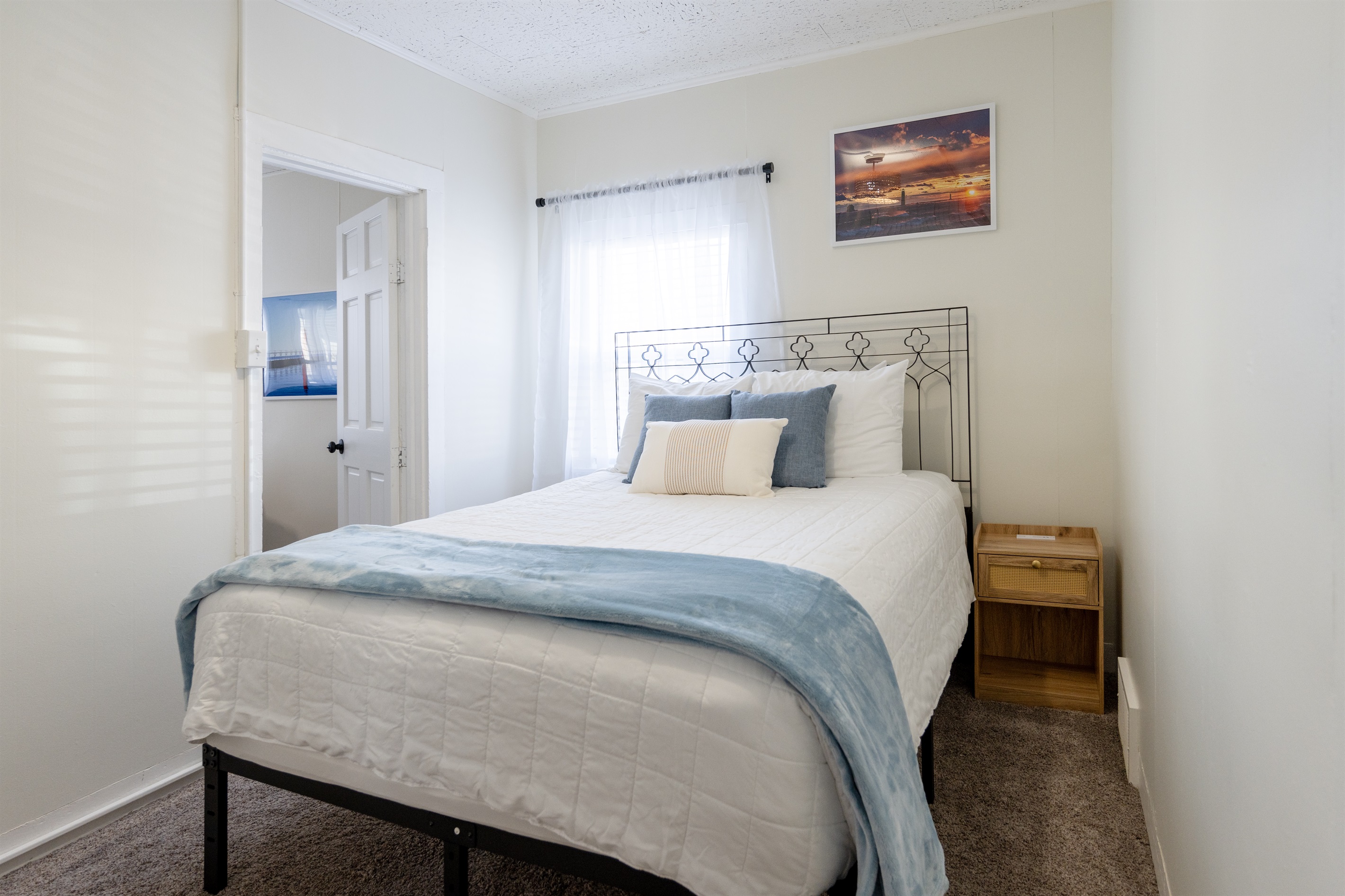 Master Bedroom: calm coastal tones with comfortable queen mattress and built-in closet