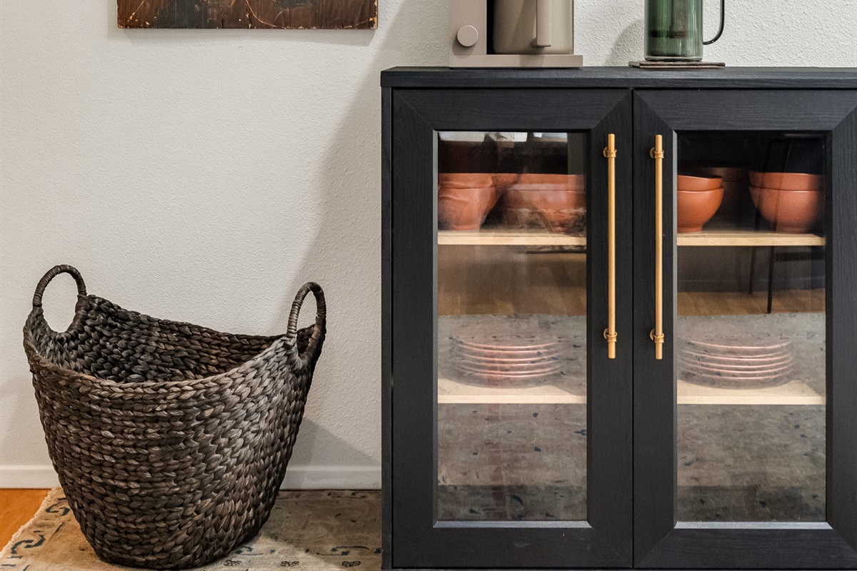 Designer touches like the rustic map of the island engraved in wood. Offer visual surprises throughout the house.