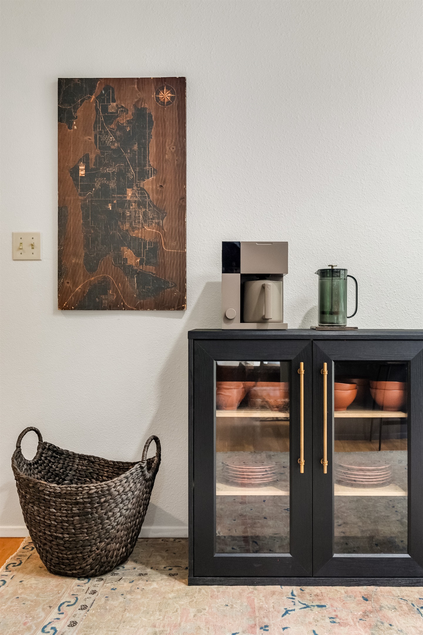 Designer touches like the rustic map of the island engraved in wood. Offer visual surprises throughout the house.