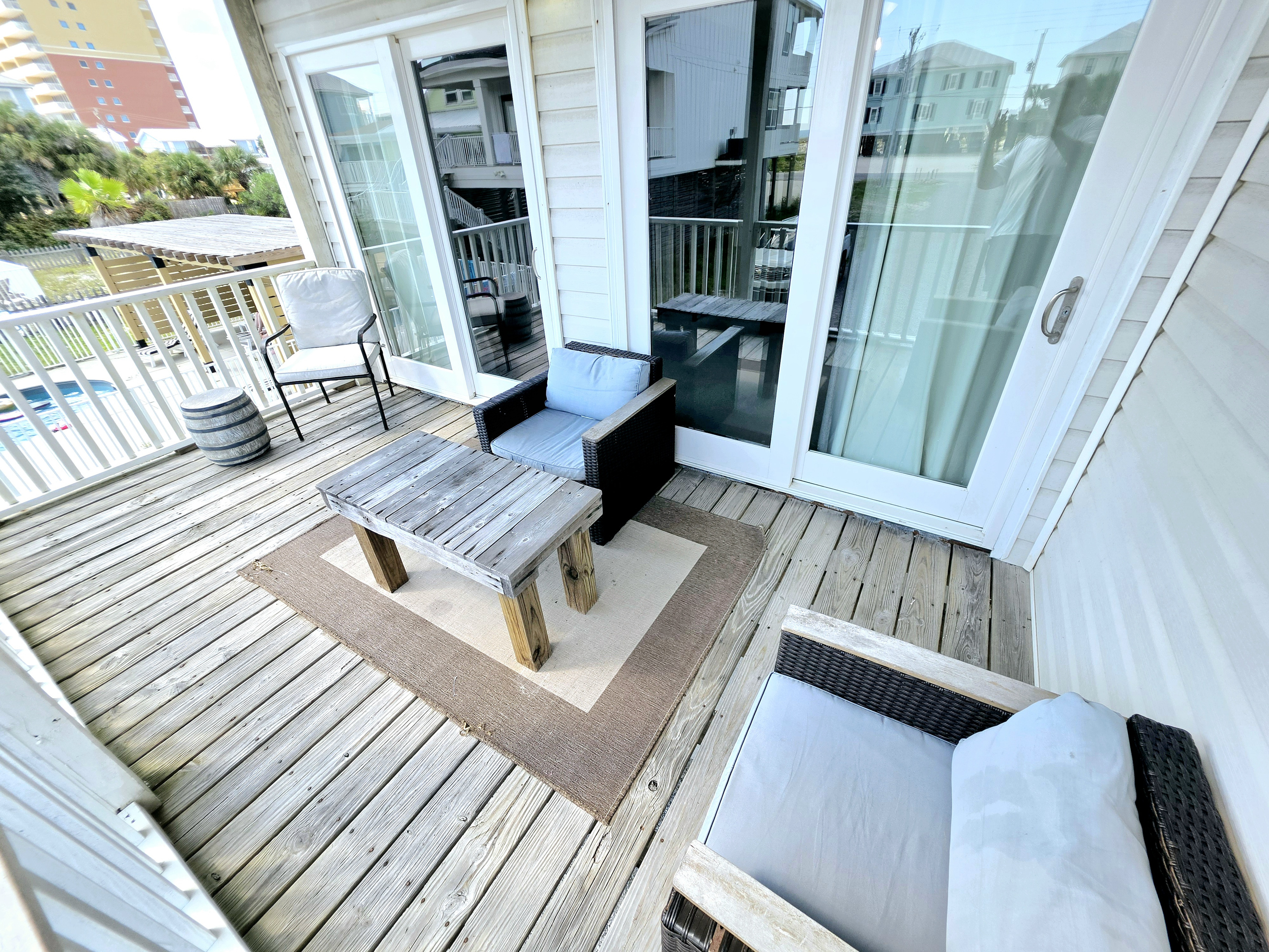 Covered balcony seating just outside the living room