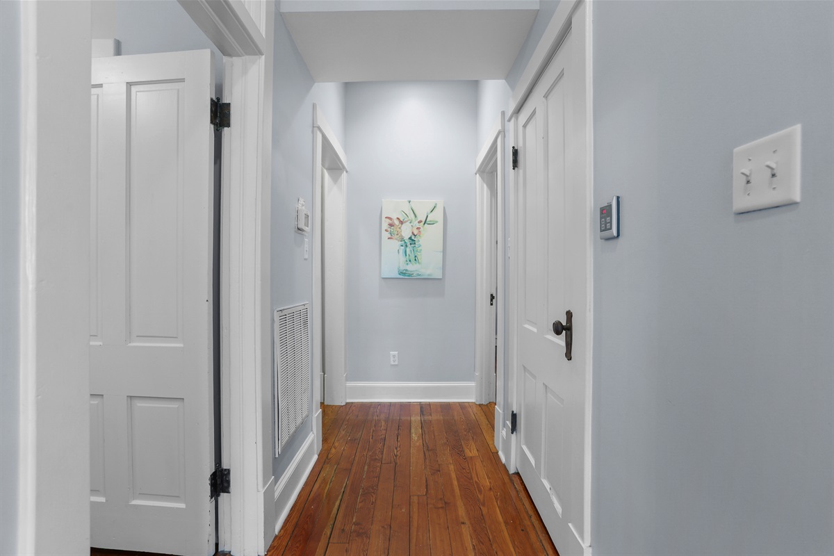 A bright hallway leads you through the heart of this charming home.