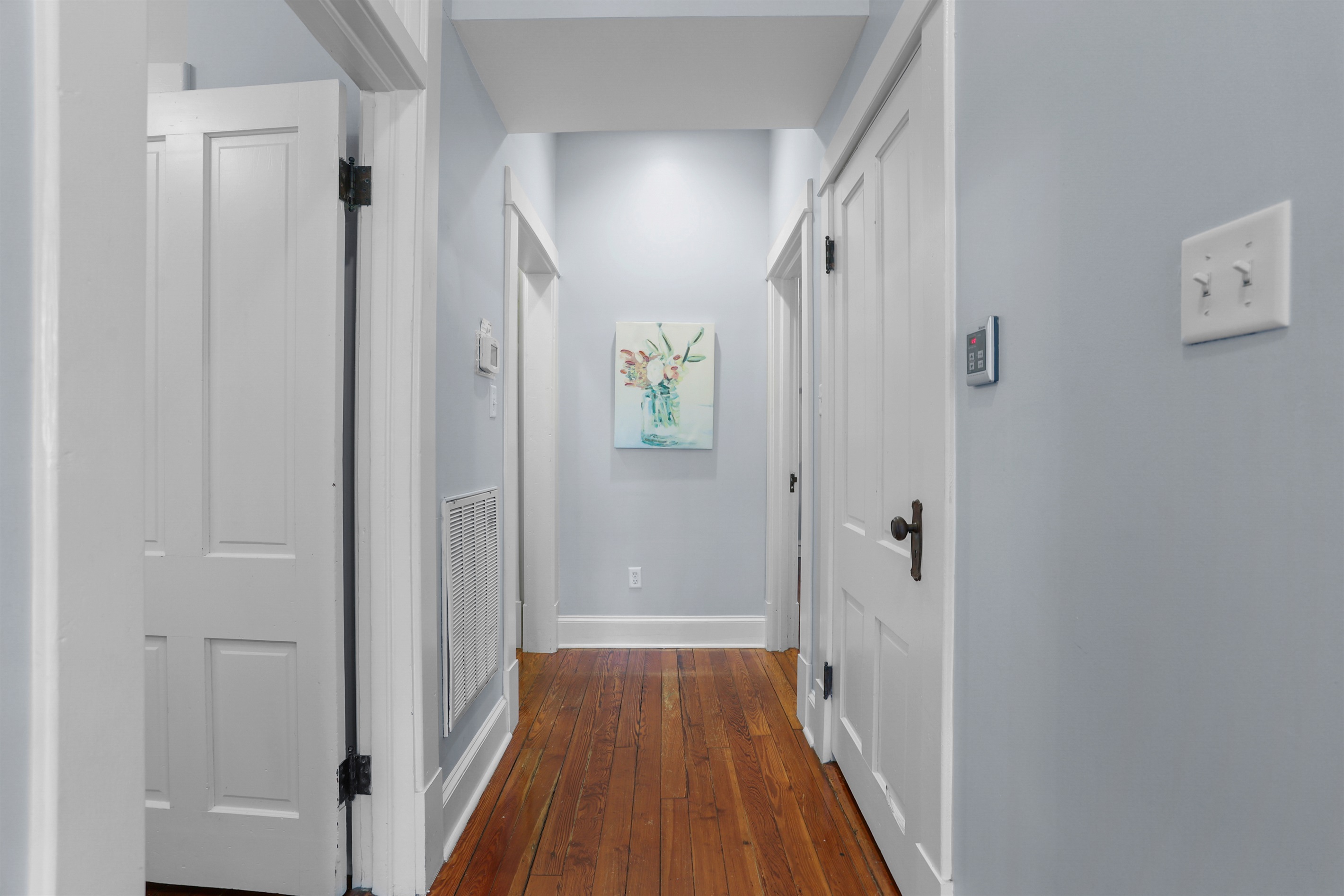 A bright hallway leads you through the heart of this charming home.