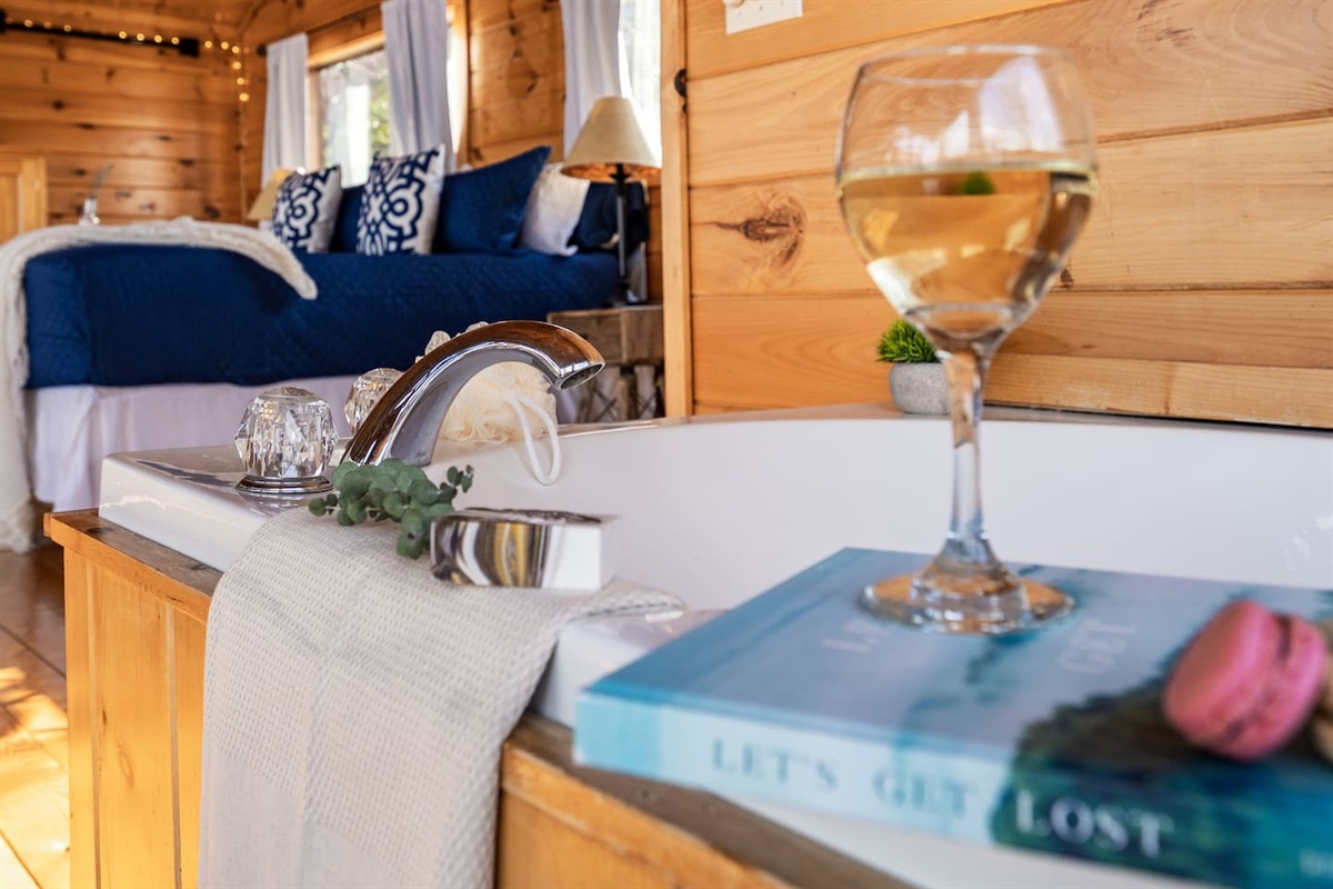 Sink into the jetted soaking tub in the loft and enjoy the view 