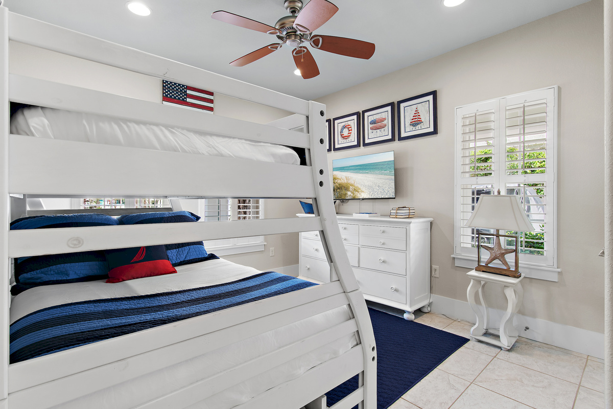 Bright and comfortable bunk room with fun coastal touches, perfect for kids or extra guests.
