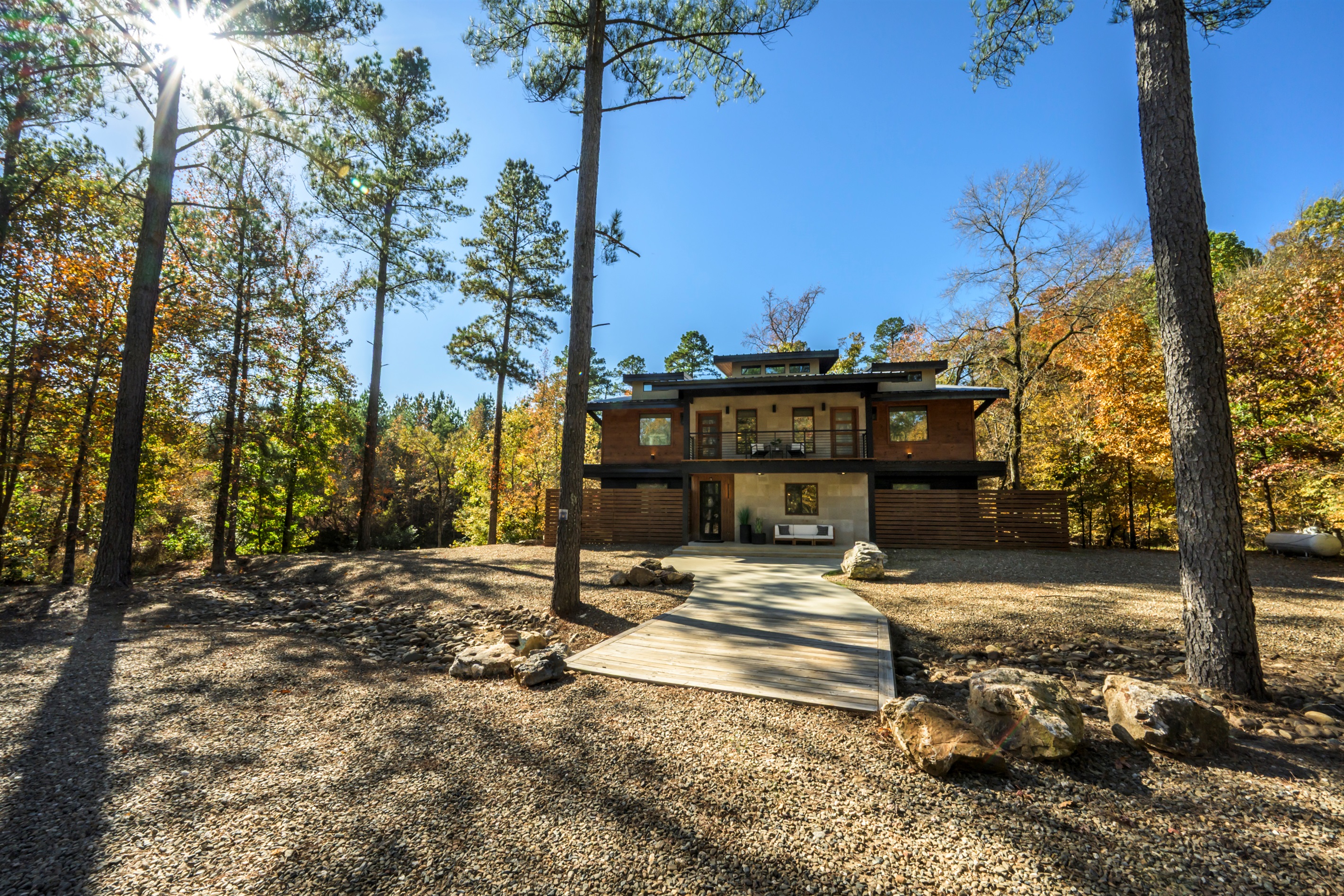 Luxury Broken Bow cabin nestled on a private wooded lot, featuring modern design and peaceful forest views