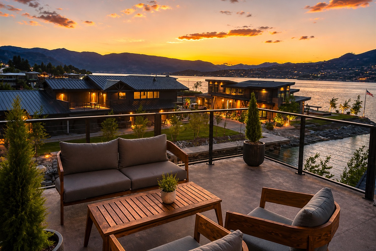 Rooftop deck with lounge seating, fire table and dining table