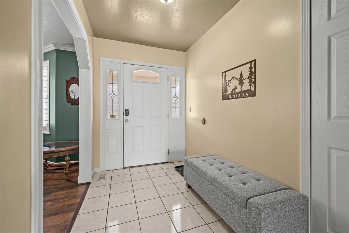 Front entryway with easy access to the home office and living spaces.
