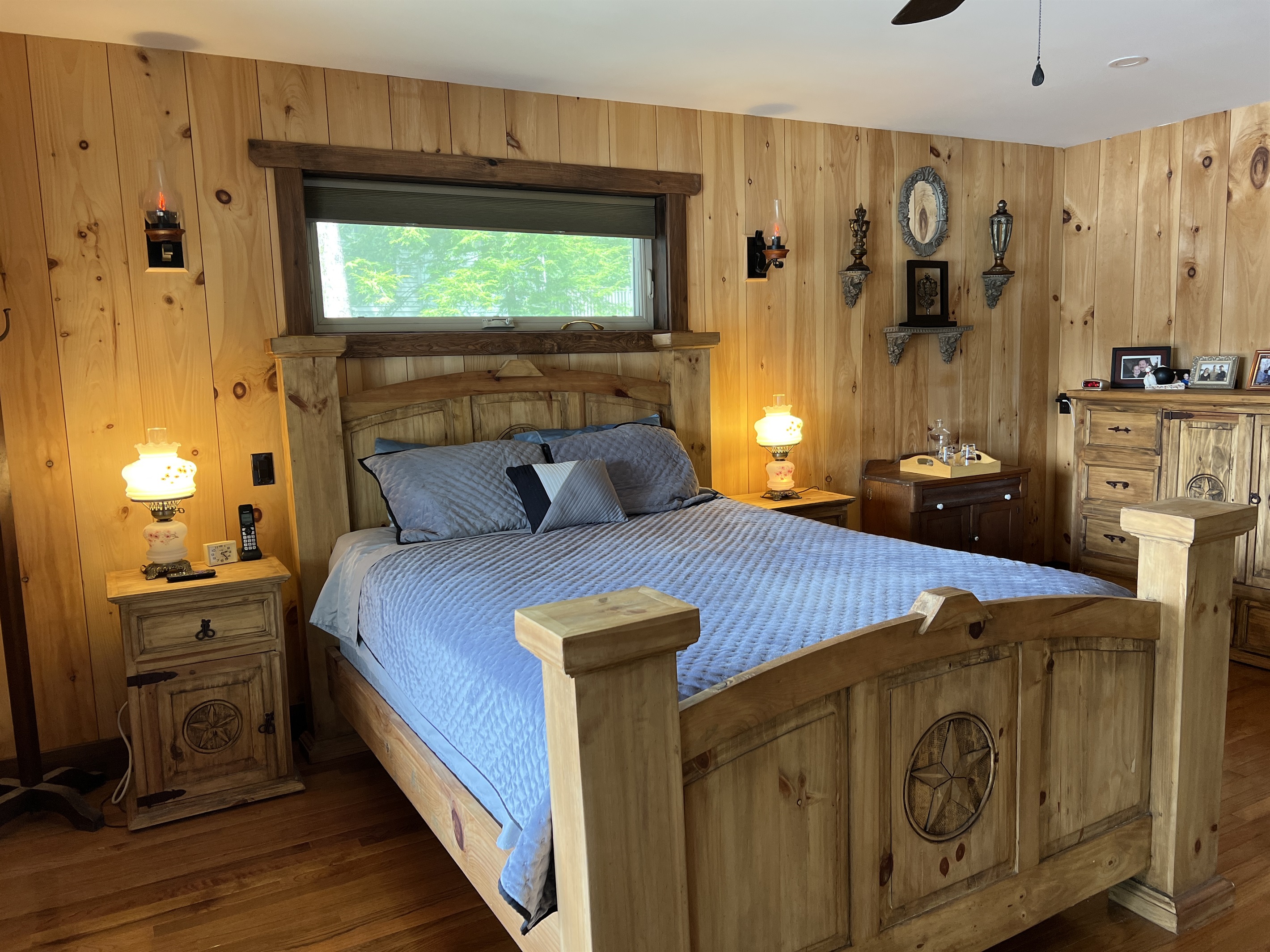 Primary bedroom with deck over looking water