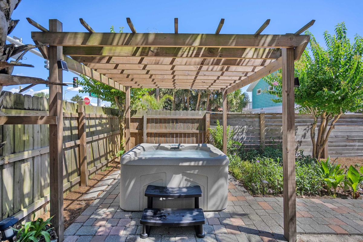 The grill sits out on the timber deck beneath the pergola, ready whenever you are. Fire it up, pour something cold, and let dinner outdoors stretch on until the light finally goes down over the fence.