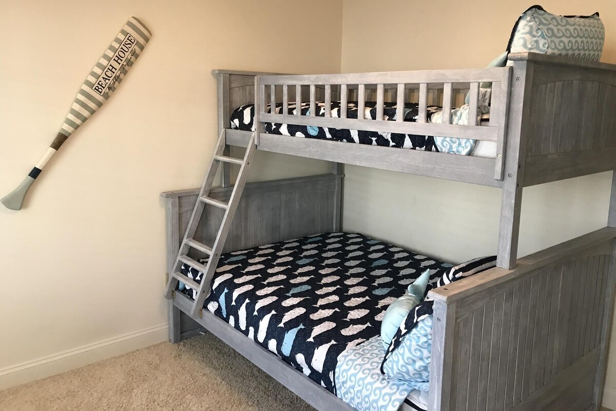 Bedroom w/ full below twin bunks (sleeps 3), TV, and balcony