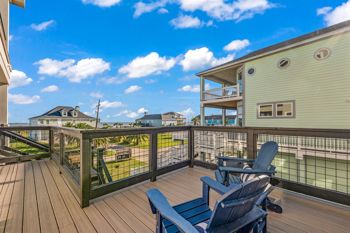 Costa Cristal Outdoor Space: Unwind on this inviting balcony designed for comfort, where shaded seating and gentle sea breezes create the perfect setting for morning coffee or sunset views. Private seating off the primary bedroom.