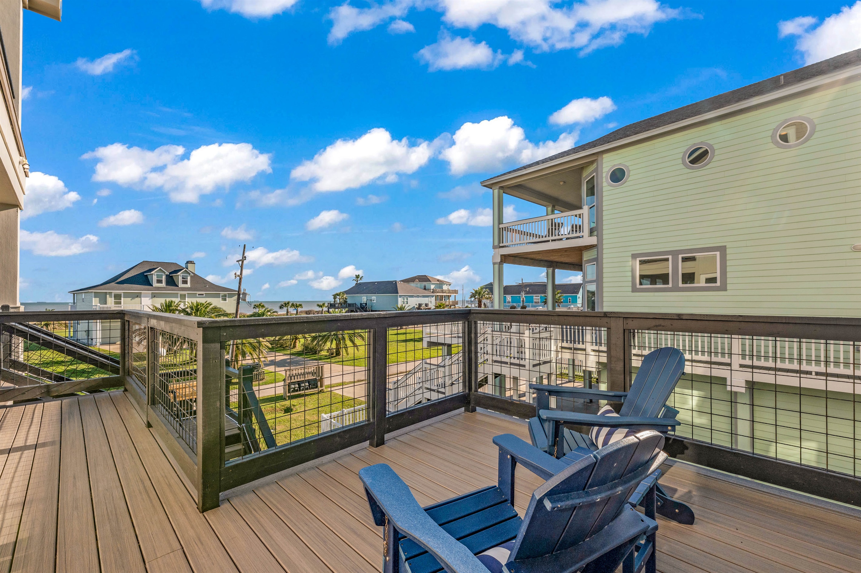 Costa Cristal Outdoor Space: Unwind on this inviting balcony designed for comfort, where shaded seating and gentle sea breezes create the perfect setting for morning coffee or sunset views. Private seating off the primary bedroom.